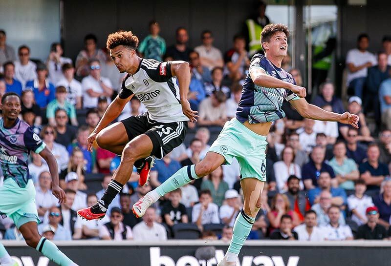 Brentford Football Club Player Christian Nörgaard and Crystal Palace’s Antonee Robinson go to header the ball